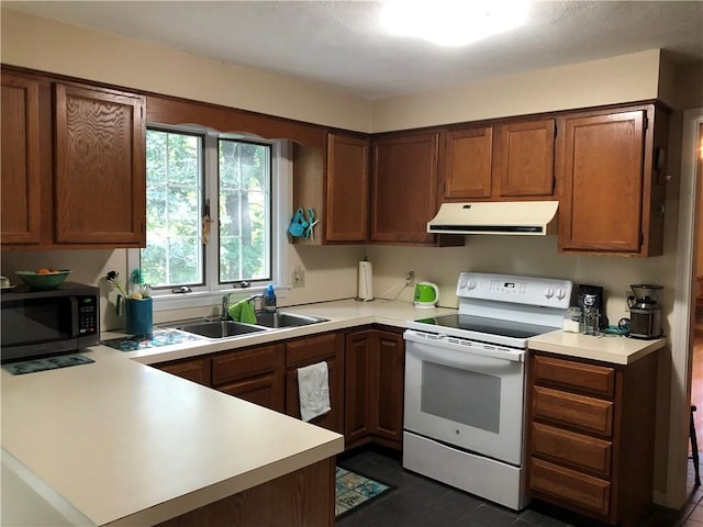 2 Marywood Ln, Cumberland, RI 02864 - kitchen with white electric range oven, ventilation hood, stainless steel microwave, and light countertops