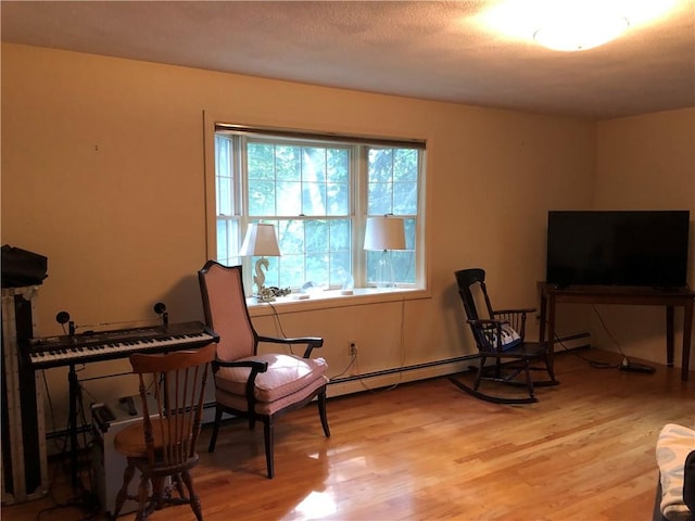 2 Marywood Ln, Cumberland, RI 02864 - living area featuring light wood-style floors and baseboard heating