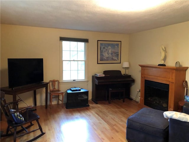 2 Marywood Ln, Cumberland, RI 02864 - living area with wood finished floors and a fireplace