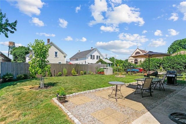 57 Maple Ave, Johnston, RI 02919 - fenced backyard with a patio, a storage shed, and outdoor dining space