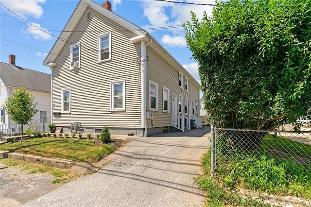 57 Maple Ave, Johnston, RI 02919 - view of property exterior featuring a chimney