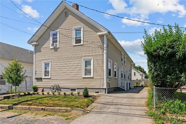 57 Maple Ave, Johnston, RI 02919 - view of property exterior featuring a chimney and cooling unit