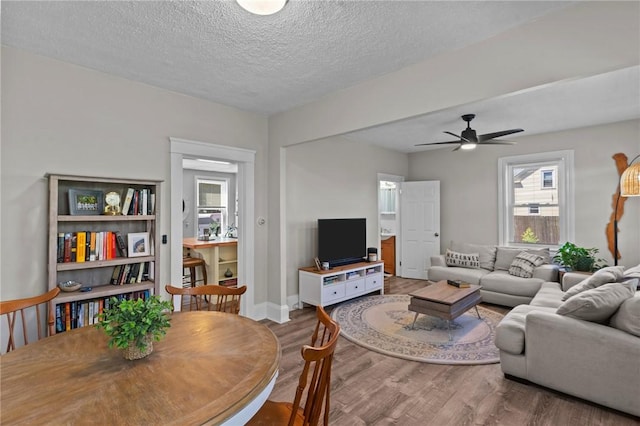 57 Maple Ave, Johnston, RI 02919 - living room with wood finished floors, ceiling fan, and a textured ceiling