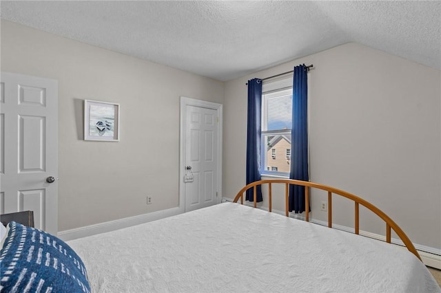 57 Maple Ave, Johnston, RI 02919 - bedroom with a textured ceiling, vaulted ceiling, and carpet
