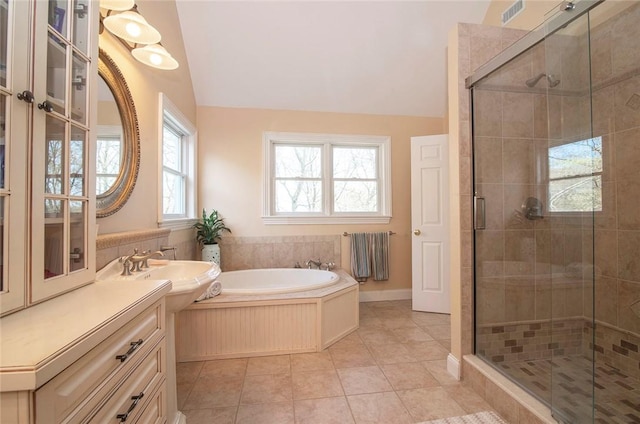 27 Tom Harvey Rd, Westerly, RI 02891 - bathroom with a garden tub, vaulted ceiling, a stall shower, vanity, and tile patterned floors