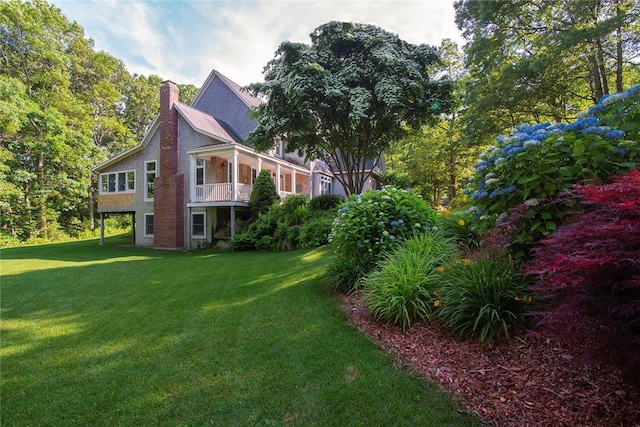 27 Tom Harvey Rd, Westerly, RI 02891 - view of side of home featuring a chimney and a lawn