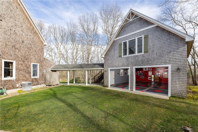 27 Tom Harvey Rd, Westerly, RI 02891 - back of property featuring stairway, a yard, and a garage