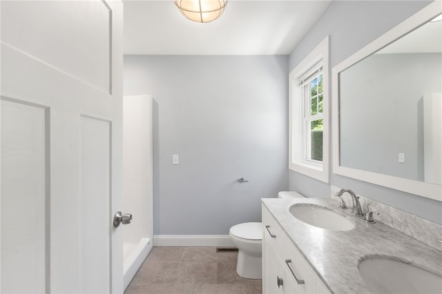 1 Lily Ln Unit 1, West Warwick, RI 02893 - bathroom featuring baseboards and double vanity
