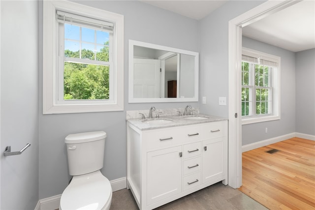 1 Lily Ln Unit 1, West Warwick, RI 02893 - bathroom with double vanity and wood finished floors