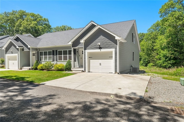 1 Lily Ln Unit 1, West Warwick, RI 02893 - ranch-style home featuring a garage, driveway, a front yard, and roof with shingles