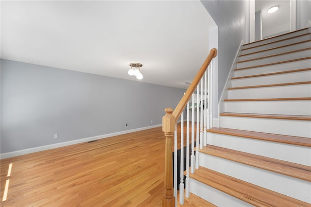 1 Lily Ln Unit 1, West Warwick, RI 02893 - staircase featuring wood finished floors and baseboards