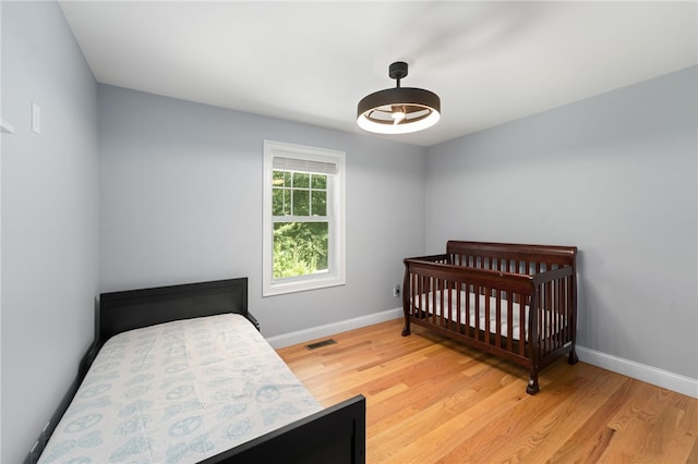 1 Lily Ln Unit 1, West Warwick, RI 02893 - bedroom with light wood-type flooring and baseboards