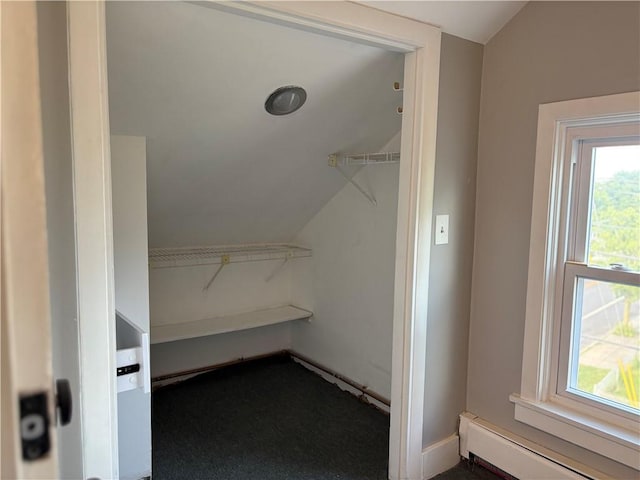 784 York Ave, Pawtucket, RI 02861 - walk in closet with a baseboard radiator, vaulted ceiling, and dark carpet