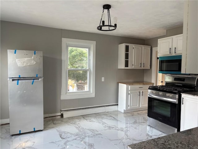 784 York Ave, Pawtucket, RI 02861 - kitchen with stainless steel range with gas stovetop, freestanding refrigerator, a baseboard heating unit, white cabinets, and light marble finish flooring