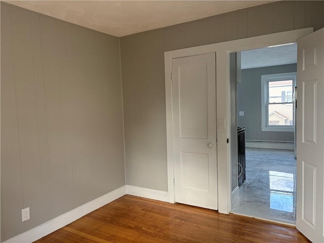 784 York Ave, Pawtucket, RI 02861 - spare room with a baseboard radiator and wood finished floors