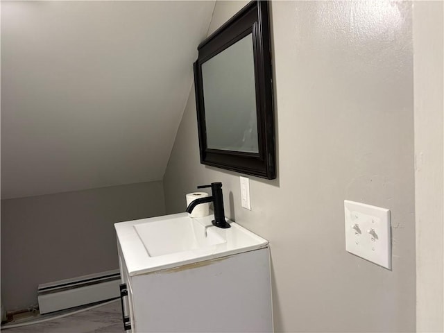 784 York Ave, Pawtucket, RI 02861 - bathroom with a baseboard radiator, vanity, marble look tiles, and vaulted ceiling