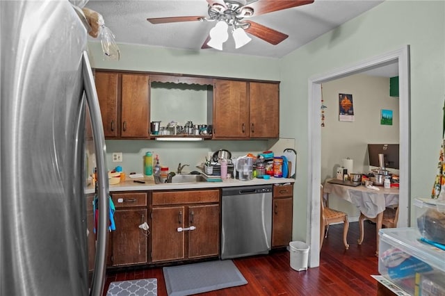 196 Old River Rd Unit 166, Lincoln, RI 02865 - kitchen featuring appliances with stainless steel finishes, dark wood finished floors, light countertops, a ceiling fan, and brown cabinets