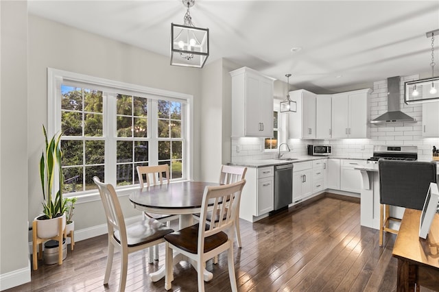 15 Mathew Rd, Tiverton, RI 02878 - dining area featuring dark wood-style flooring and a chandelier