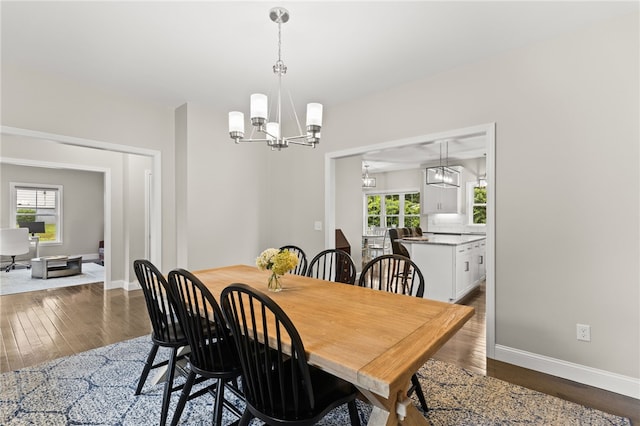 15 Mathew Rd, Tiverton, RI 02878 - dining area with a chandelier, healthy amount of natural light, and wood finished floors