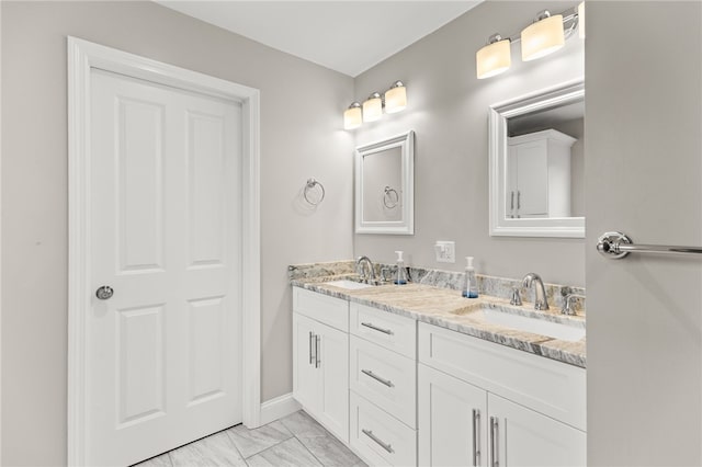 15 Mathew Rd, Tiverton, RI 02878 - bathroom with double vanity and marble look tile flooring
