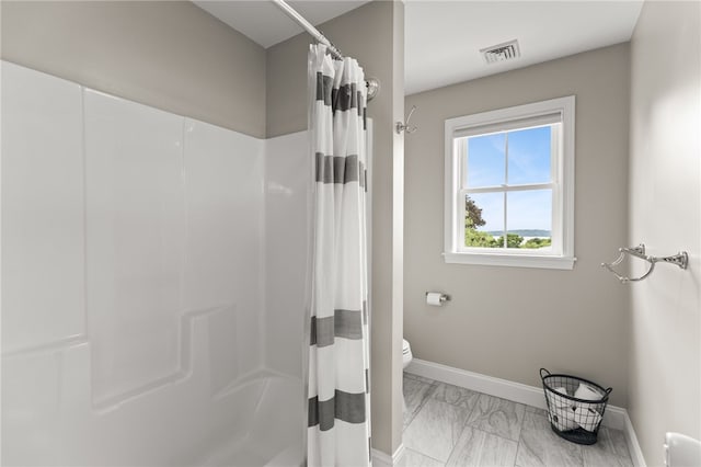 15 Mathew Rd, Tiverton, RI 02878 - bathroom with marble look tile flooring and toilet