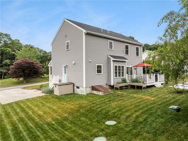 15 Mathew Rd, Tiverton, RI 02878 - back of property with a wooden deck and a yard