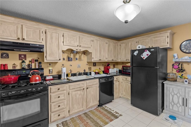 47 Morgan Ave Unit 61, Johnston, RI 02919 - kitchen with black appliances, under cabinet range hood, dark countertops, a textured ceiling, and light tile patterned flooring