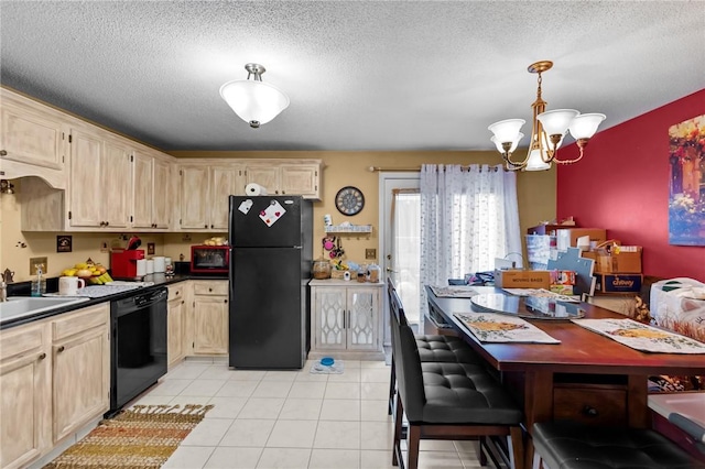 47 Morgan Ave Unit 61, Johnston, RI 02919 - kitchen with black appliances, dark countertops, a chandelier, light brown cabinetry, and a textured ceiling