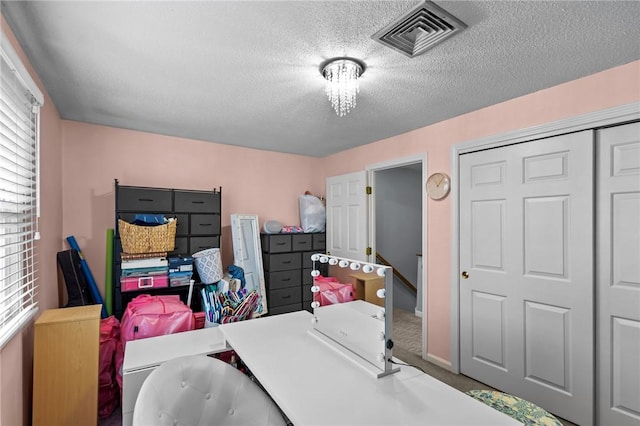 47 Morgan Ave Unit 61, Johnston, RI 02919 - carpeted bedroom with a textured ceiling and a closet