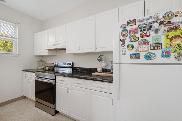 112 Mill St Unit 203, Woonsocket, RI 02895 - kitchen with freestanding refrigerator, electric stove, ventilation hood, white cabinetry, and dark stone countertops