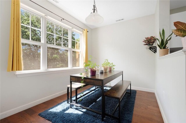 112 Mill St Unit 203, Woonsocket, RI 02895 - dining room with baseboards and wood finished floors