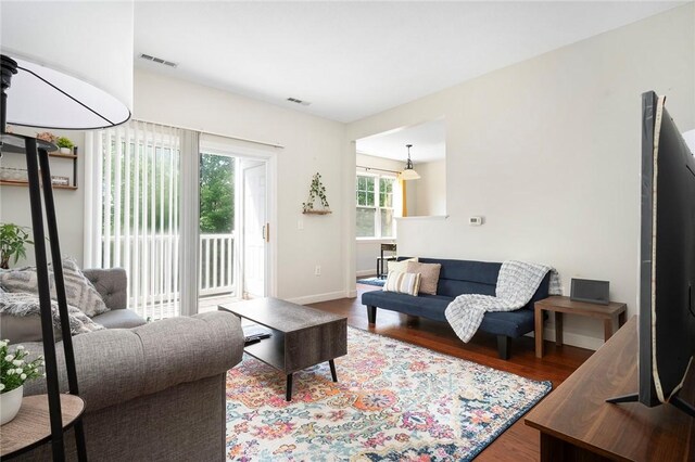 112 Mill St Unit 203, Woonsocket, RI 02895 - living area featuring wood finished floors and baseboards