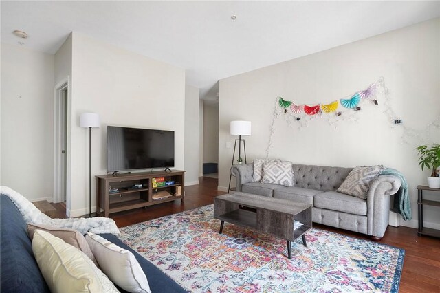 112 Mill St Unit 203, Woonsocket, RI 02895 - living area with wood finished floors and baseboards