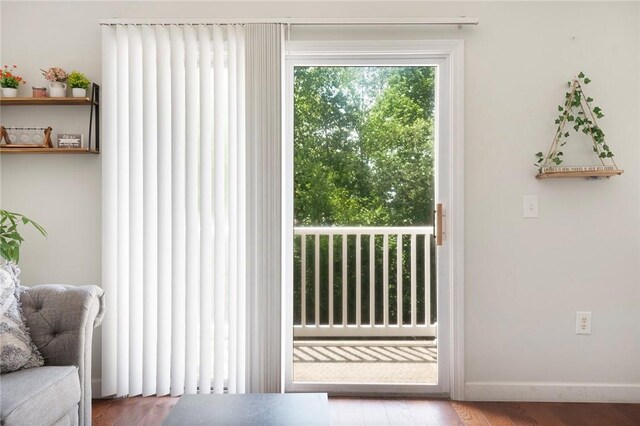 112 Mill St Unit 203, Woonsocket, RI 02895 - entryway with baseboards and wood finished floors