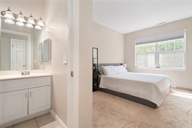 112 Mill St Unit 203, Woonsocket, RI 02895 - bedroom featuring baseboards and light carpet