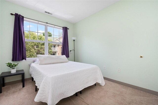 112 Mill St Unit 203, Woonsocket, RI 02895 - bedroom with carpet flooring and baseboards