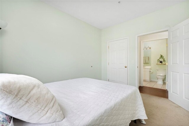 112 Mill St Unit 203, Woonsocket, RI 02895 - bedroom featuring ensuite bathroom and carpet