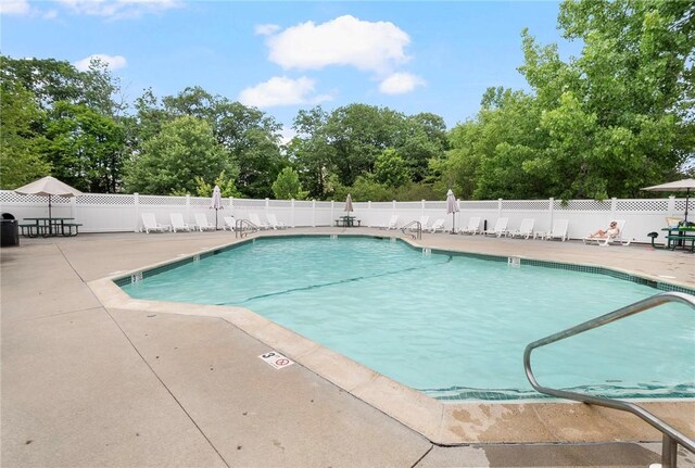 112 Mill St Unit 203, Woonsocket, RI 02895 - community pool with a patio area and view of scattered trees