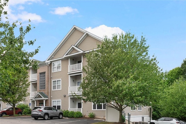 112 Mill St Unit 203, Woonsocket, RI 02895 - view of building exterior featuring uncovered parking