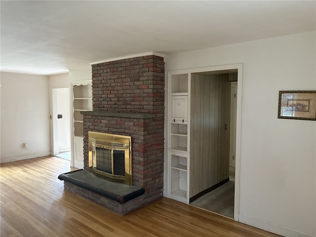 10 Jesse Davis Ln, Barrington, RI 02806 - unfurnished living room featuring a fireplace and wood finished floors