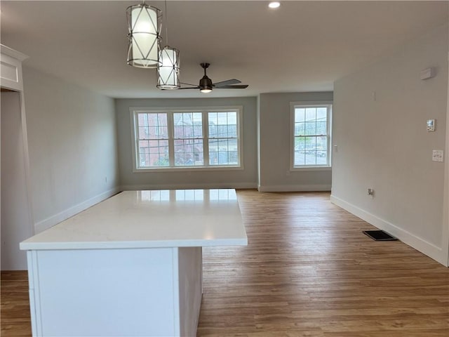 5 Crawford St, West Warwick, RI 02893 - unfurnished dining area featuring a ceiling fan, light wood-type flooring, and recessed lighting