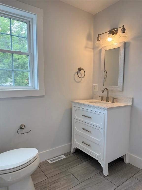5 Crawford St, West Warwick, RI 02893 - bathroom with vanity and wood finish floors