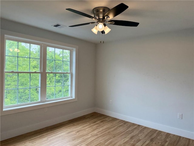 5 Crawford St, West Warwick, RI 02893 - unfurnished room with plenty of natural light, light wood-style flooring, and a ceiling fan