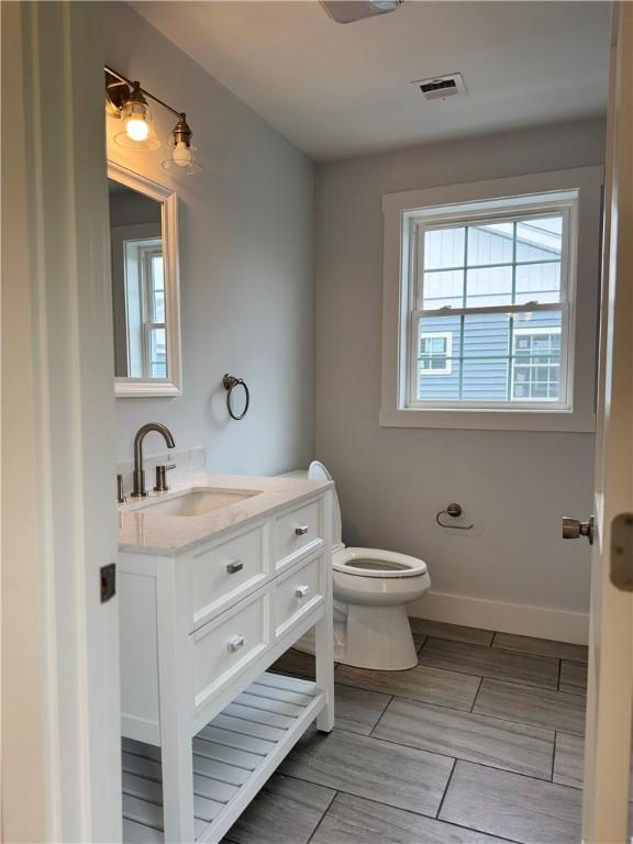 5 Crawford St, West Warwick, RI 02893 - half bathroom with vanity and toilet