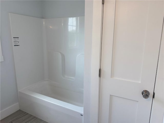 5 Crawford St, West Warwick, RI 02893 - bathroom featuring baseboards and bathtub / shower combination