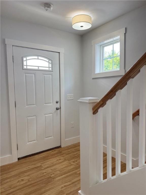 5 Crawford St, West Warwick, RI 02893 - foyer entrance featuring light wood-style flooring and stairs