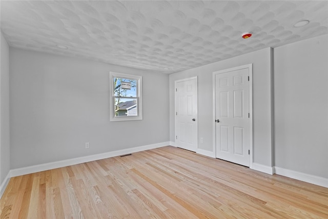 3 Riverview Ave, Westerly, RI 02891 - unfurnished bedroom featuring baseboards and light wood finished floors