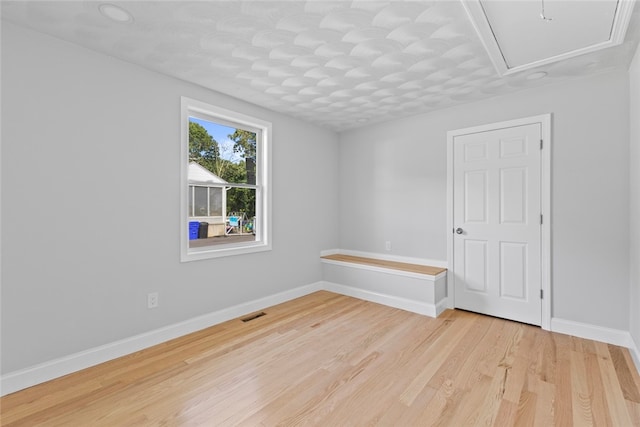 3 Riverview Ave, Westerly, RI 02891 - spare room with light wood finished floors and attic access