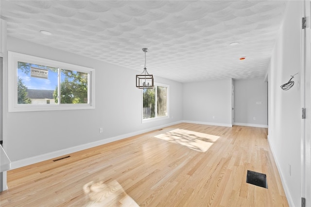 3 Riverview Ave, Westerly, RI 02891 - unfurnished dining area featuring light wood-style floors and baseboards