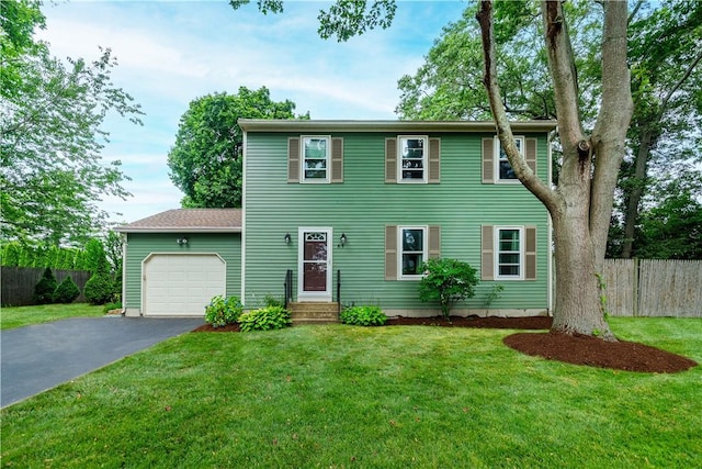 65 Jeri Lynn Cir, Warwick, RI 02886 - colonial house featuring asphalt driveway and a garage